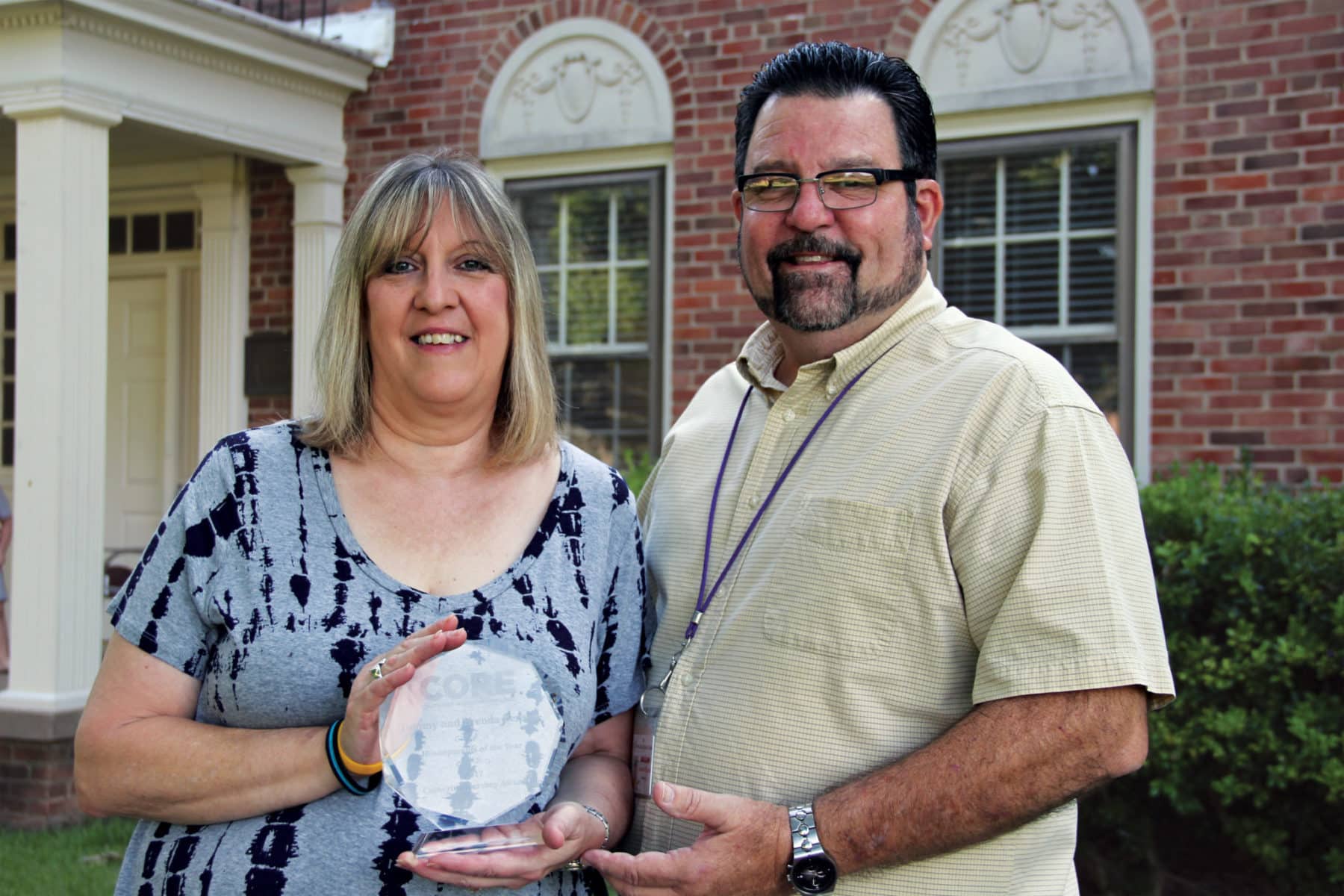 Tommy and Brenda Benson Pose with Core Award